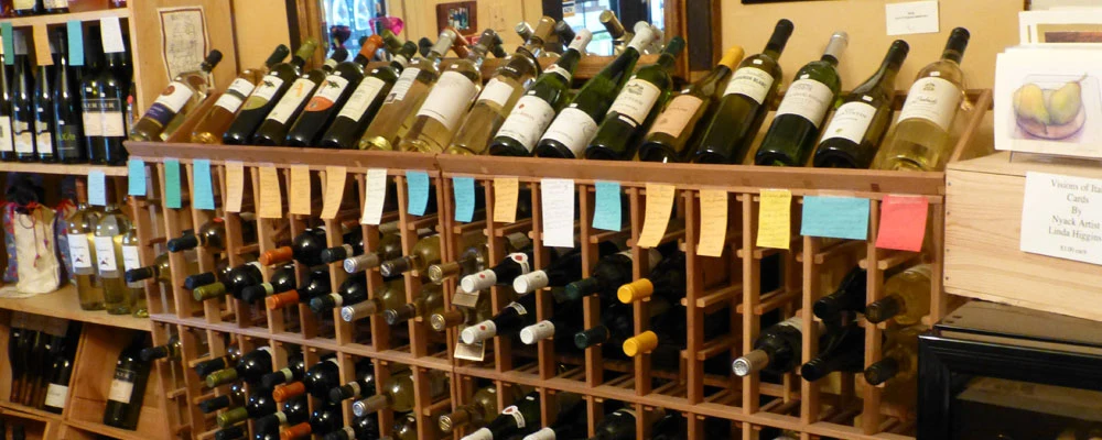 Wine racks with tasting notes inside the shop